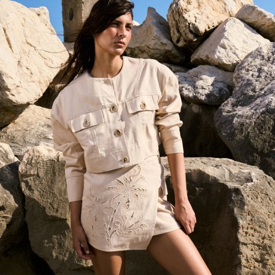 Cotton miniskirt with pierced embroidery and cargo pockets